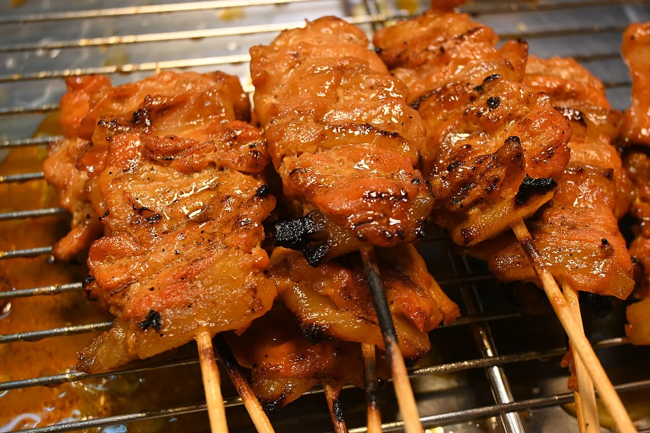 DFC 2095 Savory grilled pork skewers sizzling and caramelized to a perfect golden-brown